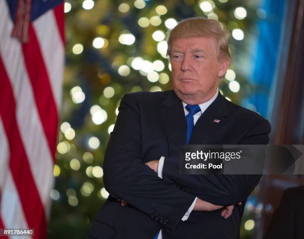 President Donald Trump listens to a group of families, Young Republicans and College Republicans at the White House, while speaking about how planned...