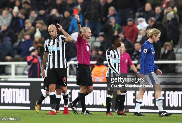 Jonjo Shelvey of Newcastle United is shown a red card by referee by Martin Atkinson during the Premier League match between Newcastle United and...