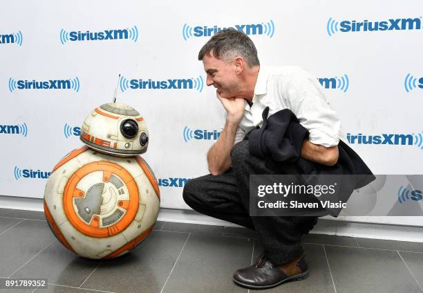 Filmmaker Paul Thomas Anderson poses with Star Wars character, Astromech Droid BB-8 at SiriusXM Studios on December 13, 2017 in New York City.