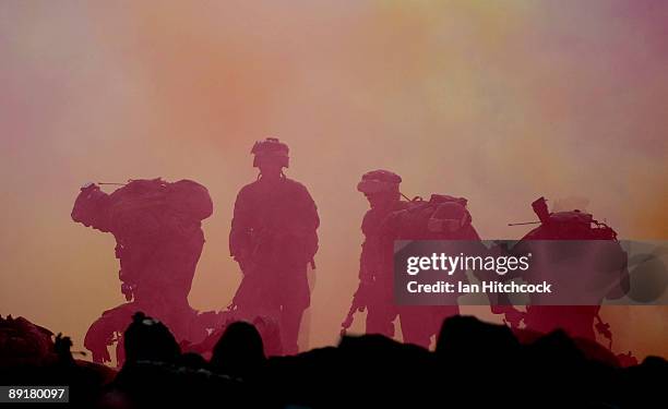 Marines from the 31st Marine Expenditionary Unit go on the attack during the combined urban combat training exercise as part of Exercise Talisman...