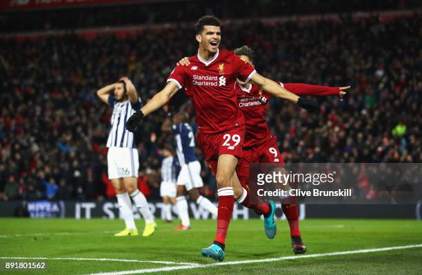 Dominic Solanke of Liverpool celebrates after scoring his sides first goal with Roberto Firmino of Liverpool but it is later disallowed during the...