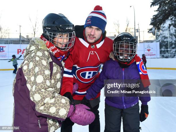 Jonathan Drouin of the Montreal Canadiens poses with children during the official inauguration of the Bleu Blanc Bouge rink by the Montreal...