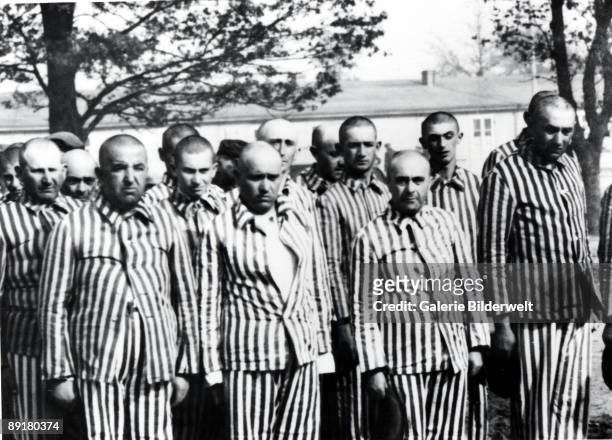 Men selected for forced labour from amongst the Hungarian Jews in Auschwitz-Birkenau, in German-occupied Poland, June 1944. Between May 2nd and July...
