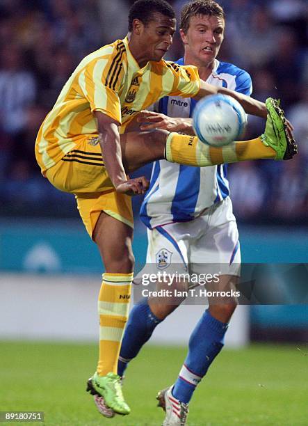 Samuel Adjei in action during a pre-season friendly match between Huddersfield Town and Newcastle United at the Galpharm Stadium on July 21, 2009 in...