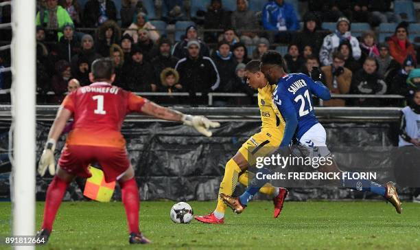 Strasbourg's French defender Yoann Salmier vies with Paris Saint-Germain's French forward Kylian Mbappe during the French League Cup round of 16...