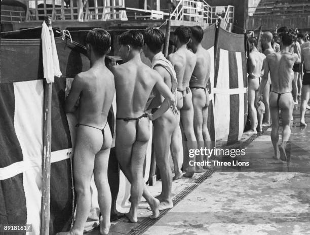 Japanese college boys at a swimming pool at the Meiji Stadium, Tokyo, circa 1955.
