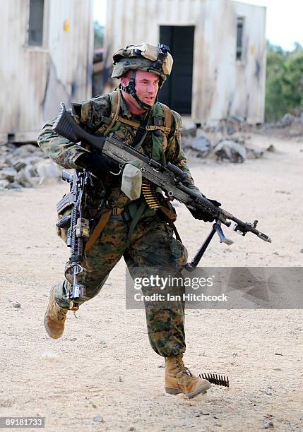 Marine from the 31st Marine Expenditionary Unit runs for cover during the combined urban combat training exercise as part of Exercise Talisman Saber...