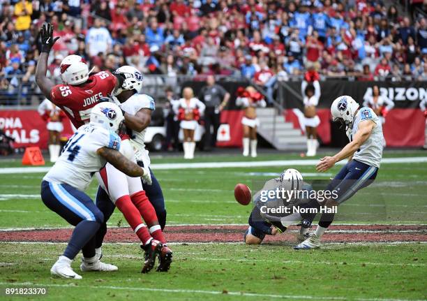 Ryan Succop of the Tennessee Titans attempts a field goal out of the hold by Brett Kern against the Arizona Cardinals at University of Phoenix...