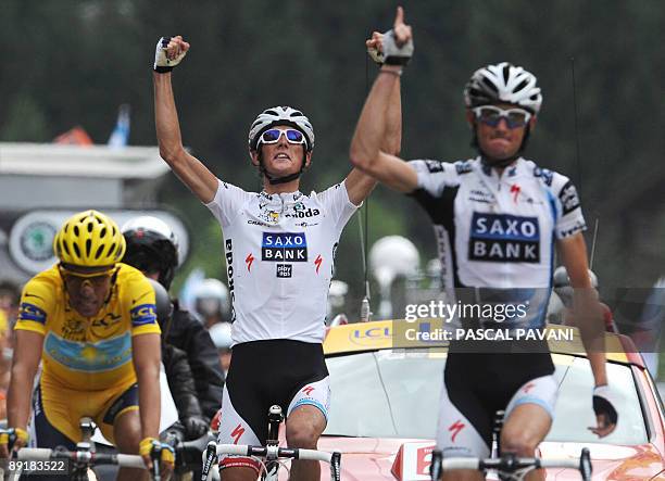 Danish cycling team Team Saxo Bank 's Frank Schleck of Luxemburg jubilates on the finish line as he wins on July 22, 2009 the 169 km and seventeenth...