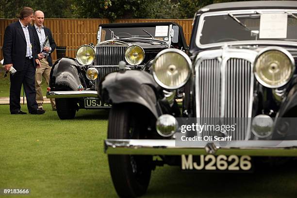 Two men view a 1933 Hispano Suiza J12 on display at the "Salon Prive" luxury and supercar event held at the Hurlingham Club on July 22, 2009 in...