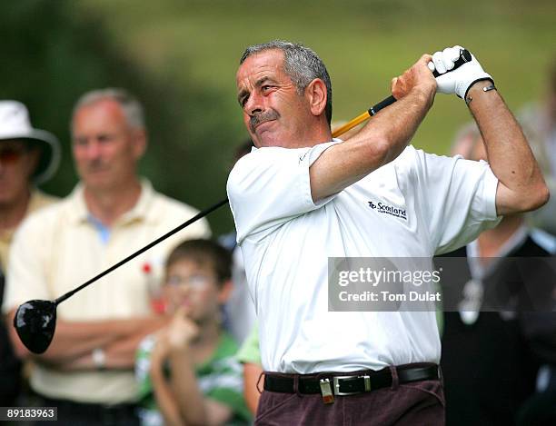 Sam Torrance tees off from the 14th hole during previews of the Senior Open Championship at the Sunningdale Golf Club on July 22, 2009 in...