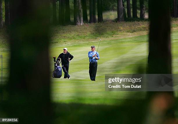 Player takes a shot during previews of the Senior Open Championship at the Sunningdale Golf Club on July 22, 2009 in Sunningdale, England. .