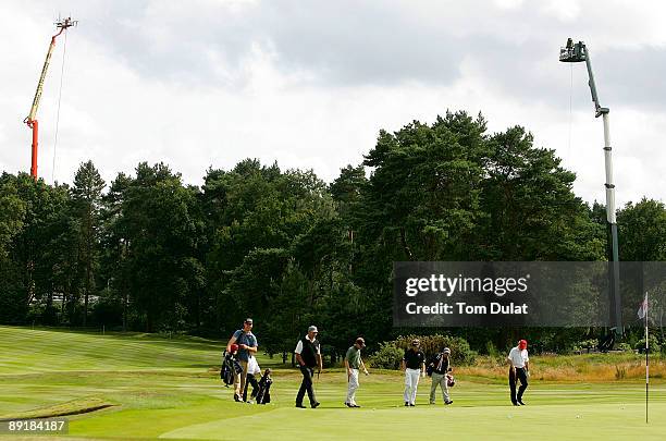 Players approach 17th green during previews of the Senior Open Championship at the Sunningdale Golf Club on July 22, 2009 in Sunningdale, England. .