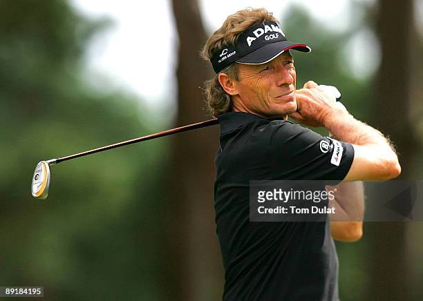 Bernard Langer tees off from the 17th hole during previews of the Senior Open Championship at the Sunningdale Golf Club on July 22, 2009 in...