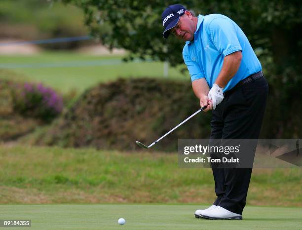 Ian Woosnam chips onto the 16th green during previews of the Senior Open Championship at the Sunningdale Golf Club on July 22, 2009 in Sunningdale,...