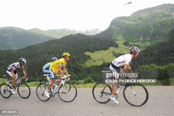 Yellow jersey of overall leader, 2007 Tour de France winner and Kazakh cycling team Astana 's leader Alberto Contador of Spain rides with Danish...