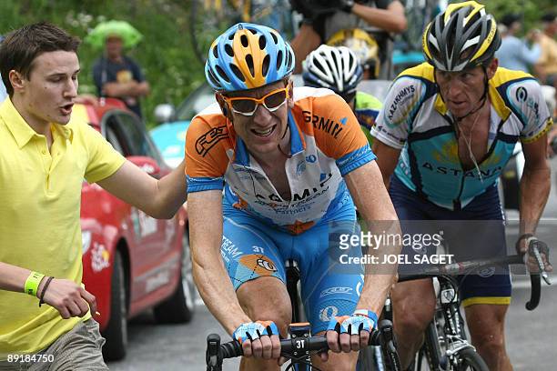 Seven-time Tour de France winner and Kazakh cycling team Astana 's Lance Armstrong of the United States rides with US cycling team Garmin-Slipstream...