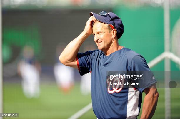 Interim Manager Jim Riggleman of the Washington Nationals watches batting practice before the game against the Chicago Cubs at Nationals Park on July...