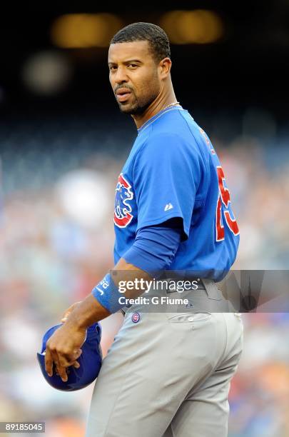 Derrek Lee of the Chicago Cubs walks towards the dugout after striking out against the Washington Nationals at Nationals Park on July 18, 2009 in...