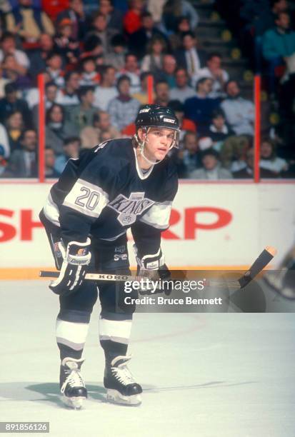 Luc Robitaille of the Los Angeles Kings waits for the face-off during an NHL game against the Philadelphia Flyers circa 1989 at the Spectrum in...