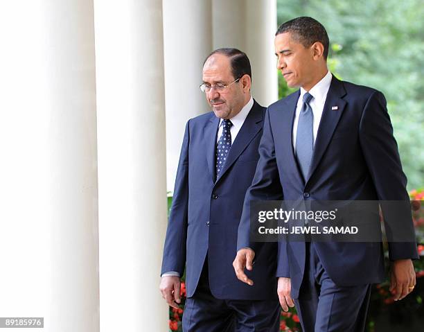 President Barack Obama and Iraqi Prime Minister Nuri al-Maliki arrive to give a joint press conference following their meeting at the Rose Garden in...