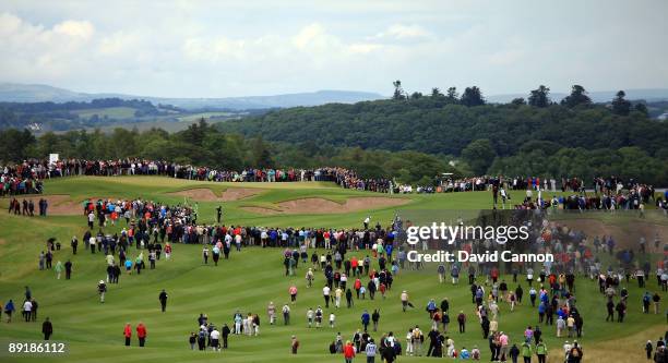 Huge crowds follow the players Padraig Harrington of Ireland and Rory McIlroy of Northern Ireland up the 6th hole during the Lough Erne Challenge, on...