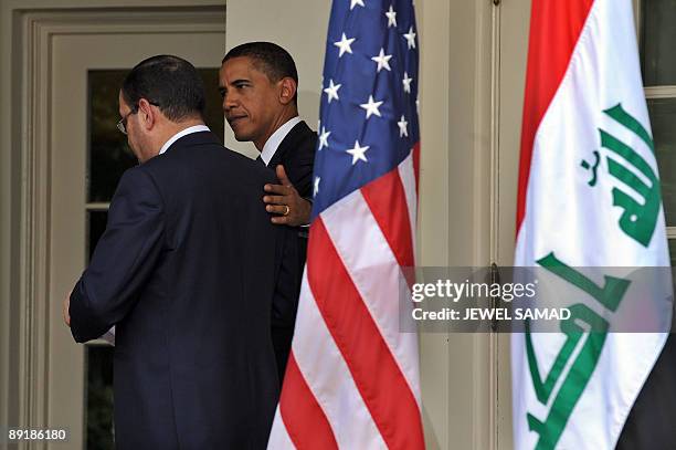 President Barack Obama and Iraqi Prime Minister Nuri al-Maliki leave after giving a joint press conference following their meeting at the Rose Garden...