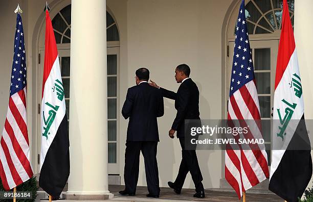 President Barack Obama and Iraqi Prime Minister Nuri al-Maliki leave after giving a joint press conference following their meeting at the Rose Garden...