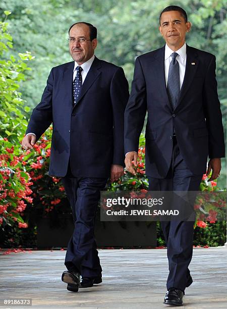 President Barack Obama and Iraqi Prime Minister Nuri al-Maliki arrive to give a joint press conference following their meeting at the Rose Garden in...