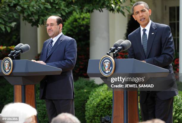 President Barack Obama answers a question as Iraqi Prime Minister Nuri al-Maliki during joint press conference following their meeting at the Rose...