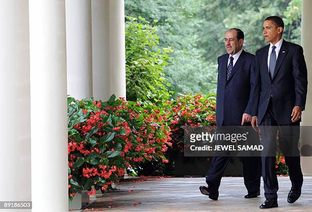 President Barack Obama and Iraqi Prime Minister Nuri al-Maliki arrive for a joint press conference following their meeting at the Rose Garden in the...