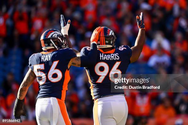 Defensive end Shelby Harris and outside linebacker Shane Ray of the Denver Broncos celebrate after a sack against the New York Jets at Sports...