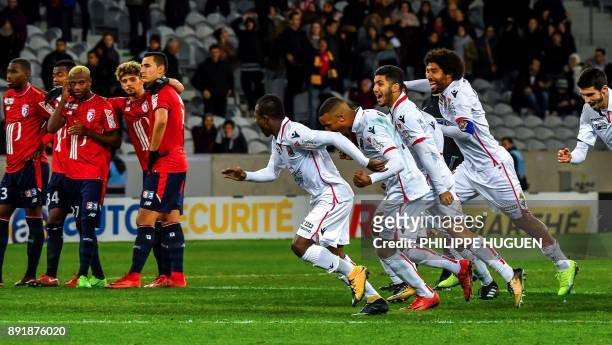 Nice's players react after winning the French League Cup round of 16 football match between Lille vs Nice on December 13, 2017 at the Pierre Mauroy...