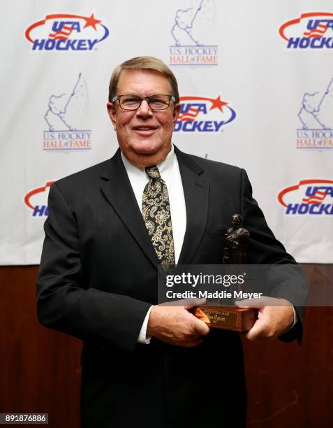 Former executive director of USA Hockey Dave Ogrean stands with his 2017 Lester Patrick Trophy before the U.S. Hockey Hall of Fame Induction at...