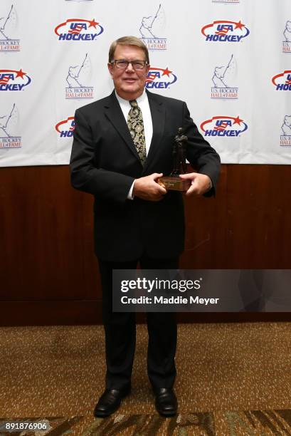 Former executive director of USA Hockey Dave Ogrean stands with his 2017 Lester Patrick Trophy before the U.S. Hockey Hall of Fame Induction at...