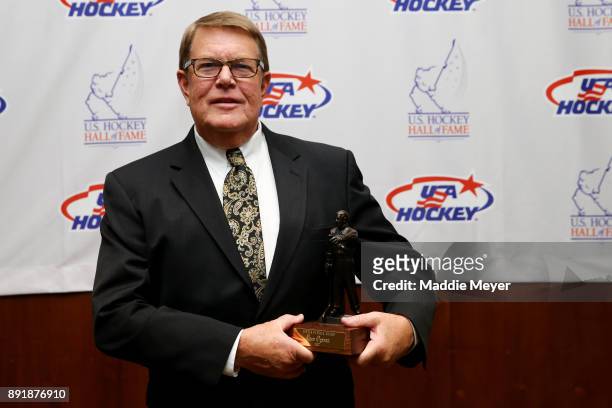Former executive director of USA Hockey Dave Ogrean stands with his 2017 Lester Patrick Trophy before the U.S. Hockey Hall of Fame Induction at...