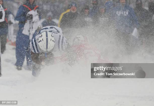 Marlon Mack of the Indianapolis Colts runs with the ball as he is tackled by Tre'Davious White of the Buffalo Bills during NFL game action at New Era...