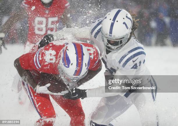 Deonte Thompson of the Buffalo Bills is tackled after making a reception by Matthias Farley of the Indianapolis Colts during NFL game action at New...