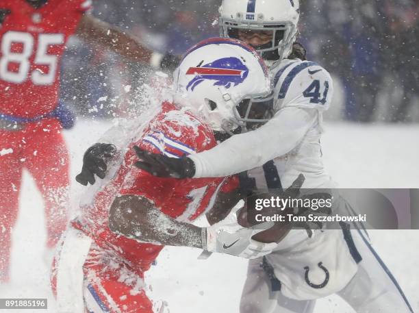 Deonte Thompson of the Buffalo Bills is tackled after making a reception by Matthias Farley of the Indianapolis Colts during NFL game action at New...