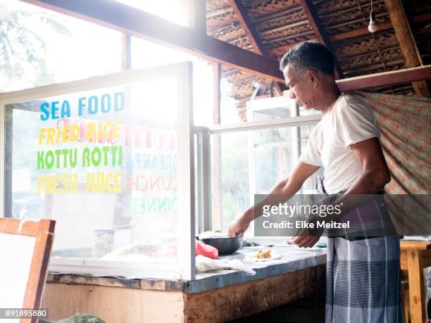 man making at food stalls preparing food - sri lankan culture stock pictures, royalty-free photos & images