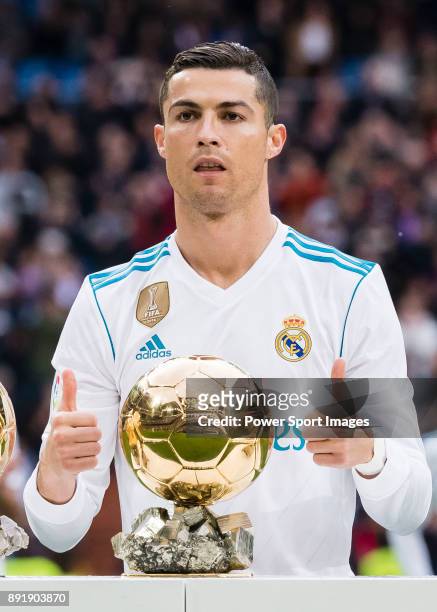 Cristiano Ronaldo of Real Madrid poses for photos with his FIFA Ballon Dor Trophies prior to the La Liga 2017-18 match between Real Madrid and...