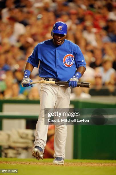 Milton Bradley of the Chicago Cubs brakes his bat after striking out during a baseball game against the Washington Nationals on July 18, 2009 at...