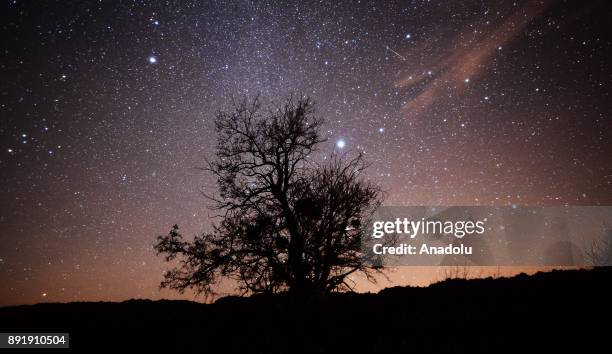 Meteors named as 'Geminid' streak across the sky over Turkey's Usak on December 13, 2017.