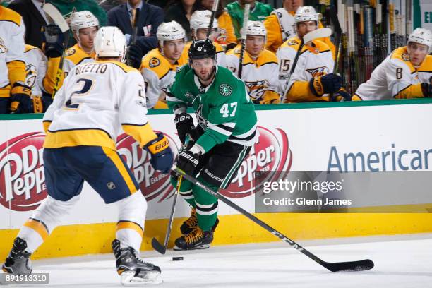 Alexander Radulov of the Dallas Stars handles the puck against Anthony Bitetto of the Nashville Predators at the American Airlines Center on December...