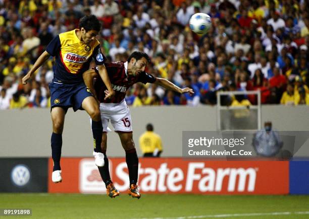 Daniel Marquez of Club America heads the ball into the goal for the game winner against Gianluca Zambrotta of AC Milan during the World Football...