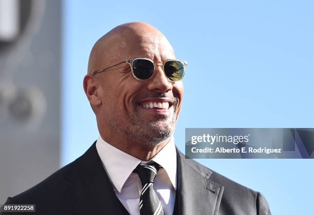 Actor Dwayne Johnson attends a ceremony honoring him with the 2,624th star on the Hollywood Walk of Fame on December 13, 2017 in Hollywood,...