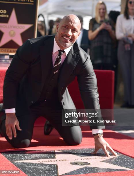 Actor Dwayne Johnson attends a ceremony honoring him with the 2,624th star on the Hollywood Walk of Fame on December 13, 2017 in Hollywood,...