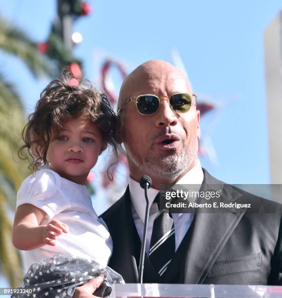 Actor Dwayne Johnson and Jasmine Johnson attend a ceremony honoring Dwayne Johnson with the 2,624th star on the Hollywood Walk of Fame on December...