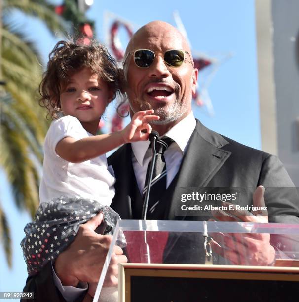 Actor Dwayne Johnson and Jasmine Johnson attend a ceremony honoring Dwayne Johnson with the 2,624th star on the Hollywood Walk of Fame on December...