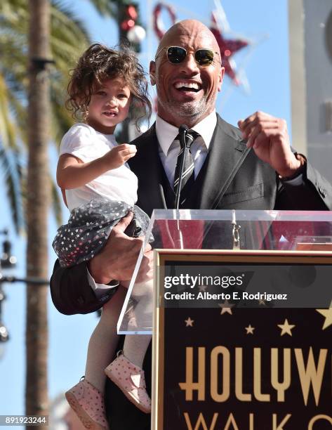 Actor Dwayne Johnson and Jasmine Johnson attend a ceremony honoring Dwayne Johnson with the 2,624th star on the Hollywood Walk of Fame on December...